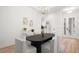 Dining room with wood floors and modern light fixture at 14634 Mirasol Manor Ct, Tampa, FL 33626