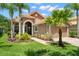 Beautiful single Gathering home boasts tropical landscaping and a tile roof at 14634 Mirasol Manor Ct, Tampa, FL 33626
