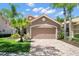 Two car garage with a brick paved drive way in front of the home at 14634 Mirasol Manor Ct, Tampa, FL 33626