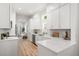 Bright kitchen boasts stone counters, new cabinets and stainless appliances at 14634 Mirasol Manor Ct, Tampa, FL 33626
