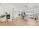 Bright living room boasts hardwood floors, lots of natural light, and neutral tones at 14634 Mirasol Manor Ct, Tampa, FL 33626