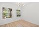 Well-lit office featuring modern light fixture and natural light from large window with shutters at 14634 Mirasol Manor Ct, Tampa, FL 33626