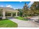 Community playground featuring a covered picnic area, playground equipment, and a walking path at 14634 Mirasol Manor Ct, Tampa, FL 33626