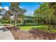 Community playground with slides, climbing structures, and a covered picnic area for residents at 14634 Mirasol Manor Ct, Tampa, FL 33626