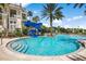 Gathering-friendly pool area with a thrilling blue slide and ample seating under the sun at 14634 Mirasol Manor Ct, Tampa, FL 33626