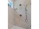 Bathroom shower with herringbone tile design, rainfall shower head, and built-in niche at 14634 Mirasol Manor Ct, Tampa, FL 33626