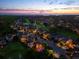 Stunning aerial view of a golf course community at sunset near the ocean at 1570 Marinella Dr, Palm Harbor, FL 34683