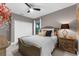 A spacious bedroom features carpeted floors, a ceiling fan, a window with blinds, and neutral paint at 1570 Marinella Dr, Palm Harbor, FL 34683