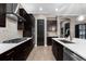 This modern kitchen has stainless steel appliances, a gas cooktop, and custom cabinets with white countertops at 1570 Marinella Dr, Palm Harbor, FL 34683