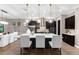 Beautiful, modern kitchen boasts a large island, stainless steel appliances, and stylish pendant lighting at 1570 Marinella Dr, Palm Harbor, FL 34683