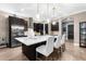 Modern kitchen featuring stainless steel appliances, an island with seating, and pendant lighting at 1570 Marinella Dr, Palm Harbor, FL 34683