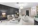 Sophisticated living room showcasing a modern accent wall, stylish furniture, and contemporary decor at 1570 Marinella Dr, Palm Harbor, FL 34683