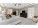 Spacious main bedroom with a ceiling fan, a dresser, and a comfortable chair at 1570 Marinella Dr, Palm Harbor, FL 34683