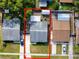 Aerial view showcasing property boundaries, backyard with shed, and driveway with parking at 16011 Saddle Creek Dr, Tampa, FL 33618