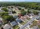 An aerial view highlights the home's location within a well-maintained neighborhood at 16011 Saddle Creek Dr, Tampa, FL 33618