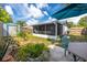 This backyard features a fenced yard, a storage shed, a patio, and a well-manicured lawn at 16011 Saddle Creek Dr, Tampa, FL 33618
