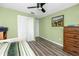 Bedroom with a closet, dresser, and green walls at 16011 Saddle Creek Dr, Tampa, FL 33618