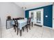 Cozy dining area with a table set for four, adjacent to the kitchen at 16011 Saddle Creek Dr, Tampa, FL 33618