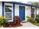 Inviting front door of this home surrounded by colorful plants and manicured landscaping at 16011 Saddle Creek Dr, Tampa, FL 33618