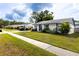 Charming single-story home boasts a well-manicured lawn and inviting curb appeal at 16011 Saddle Creek Dr, Tampa, FL 33618