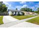 Beautiful single-story home features a lush green lawn and a welcoming entrance at 16011 Saddle Creek Dr, Tampa, FL 33618