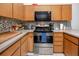 Well-equipped kitchen with stainless steel appliances and sleek countertops, ready for cooking at 16011 Saddle Creek Dr, Tampa, FL 33618
