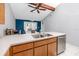 Open kitchen with stainless steel dishwasher and a view into the dining area at 16011 Saddle Creek Dr, Tampa, FL 33618