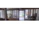 Sunroom enclosed by multiple windows providing ample natural light and views at 1735 Cleveland St, Clearwater, FL 33755