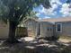Home backyard exterior with a tree providing shade, showing a space needing landscaping at 2011 Oakwood Ave, Tampa, FL 33605