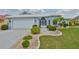 Attractive home featuring a neat front lawn, decorative landscaping, and a convenient driveway at 2252 New Bedford Dr, Sun City Center, FL 33573