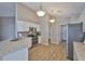 Bright kitchen features white cabinets, stainless steel appliances, and speckled granite countertops at 2252 New Bedford Dr, Sun City Center, FL 33573