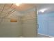 Spacious walk-in closet with ample shelving for storage and organization at 2252 New Bedford Dr, Sun City Center, FL 33573