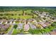 An aerial view of a residential neighborhood showcasing mature tree coverage at 23325 Abercorn Ln, Land O Lakes, FL 34639