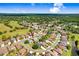 An aerial view of this home in a golf course community with mature trees and lush landscaping at 23325 Abercorn Ln, Land O Lakes, FL 34639