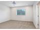Bright bedroom with carpet, a ceiling fan, and a window at 23325 Abercorn Ln, Land O Lakes, FL 34639