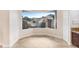 Cozy dining area with granite counters and a view of a private outdoor waterfall feature at 23325 Abercorn Ln, Land O Lakes, FL 34639