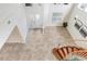 Spacious foyer with tile flooring, a curved staircase, and a view of the entry doors at 23325 Abercorn Ln, Land O Lakes, FL 34639