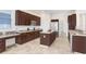 Well-equipped kitchen with a center island, stainless steel refrigerator, and ample storage space at 23325 Abercorn Ln, Land O Lakes, FL 34639