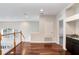 Bright living room featuring hardwood floors, staircase, and sink with granite countertop at 23325 Abercorn Ln, Land O Lakes, FL 34639