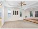 Spacious living room features high ceilings, multiple windows, and a raised platform area at 23325 Abercorn Ln, Land O Lakes, FL 34639