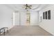 Bright living room features neutral carpet, high ceilings, and three walls of windows at 23325 Abercorn Ln, Land O Lakes, FL 34639