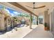 Covered patio features a built-in waterfall feature and tranquil outdoor living space at 23325 Abercorn Ln, Land O Lakes, FL 34639