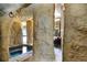 The pool grotto features intricate rock work, creating a private and shaded space at 23325 Abercorn Ln, Land O Lakes, FL 34639