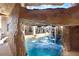 The pool grotto creates a unique water feature with views to the house and pool at 23325 Abercorn Ln, Land O Lakes, FL 34639