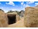 A view out from the pool grotto, which includes a walkthrough tunnel and rock features at 23325 Abercorn Ln, Land O Lakes, FL 34639