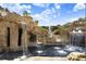The rock waterfall feature of the pool has a grotto with multiple cascades into the crystal blue water at 23325 Abercorn Ln, Land O Lakes, FL 34639
