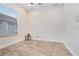 Clean and bright room with tile flooring and a window at 23325 Abercorn Ln, Land O Lakes, FL 34639