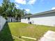 Well-maintained backyard features lush green grass and a storage shed at 2433 Blind Pond Ave, Lutz, FL 33549
