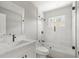 Updated bathroom featuring a shower-over-tub with glass door and a white vanity at 2433 Blind Pond Ave, Lutz, FL 33549