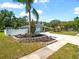 Attractive home boasts a fresh driveway, white privacy fence, well-kept lawn, and appealing landscaping at 2433 Blind Pond Ave, Lutz, FL 33549